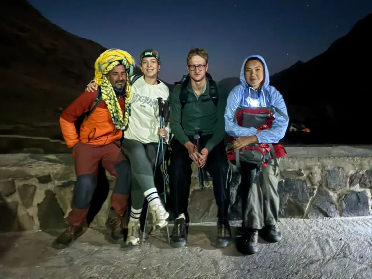 Group of hikers enjoying the stunning views during a 2-day trek to Mount Toubkal, the highest peak in North Africa.